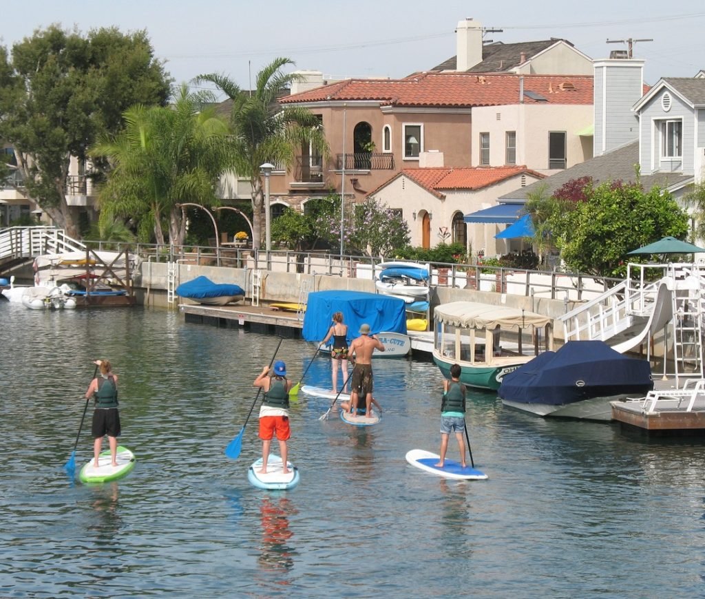 Paddleboarders on canal Long Beach CA