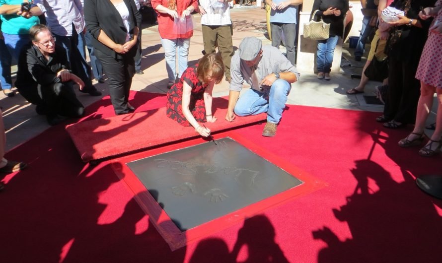 Author Lisa See puts her hands in cement at Vroman’s new Authors Walk of Fame in Pasadena