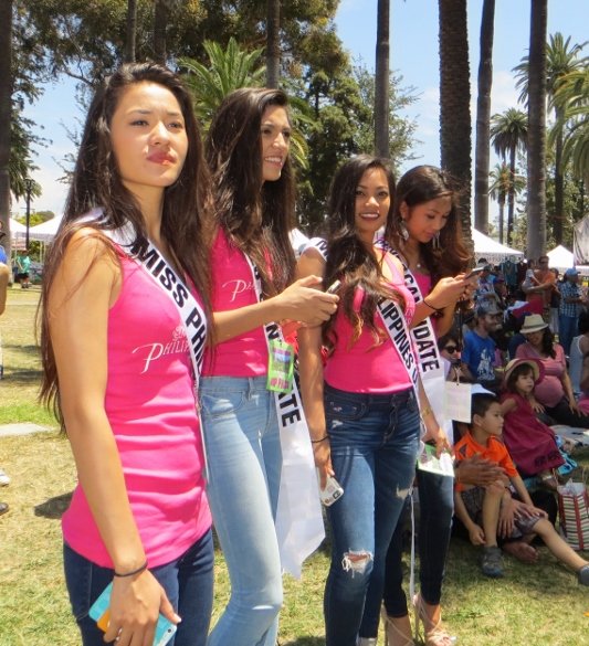 Four young ladies who are candidates for Miss Young Philippines USA were in the audience watching the Lion Dancers.
