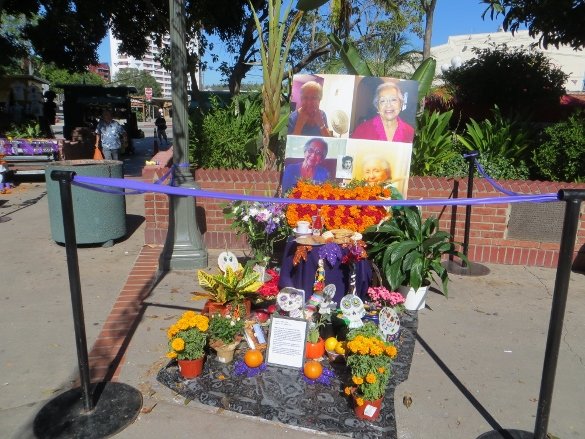 A family altar honoring women, abuelas, who have passed away. Note the marigold flowers which appeared on every altar.