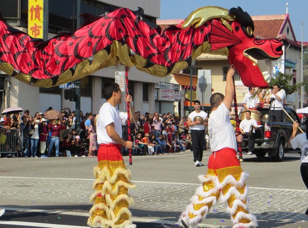 Red Chinese dragon with l;ion dancers